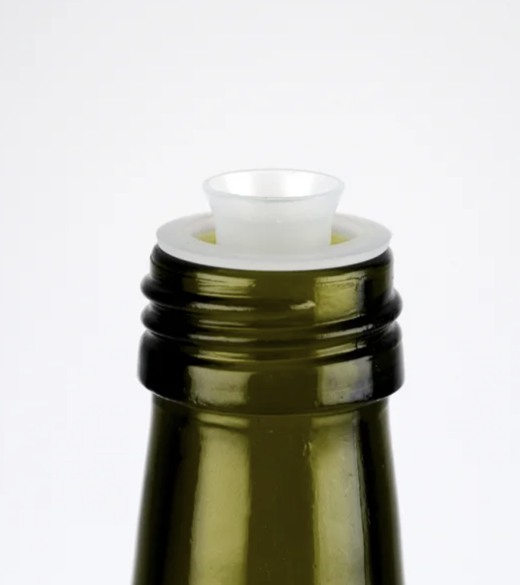 Tamper evident pourer insert in the bottle neck