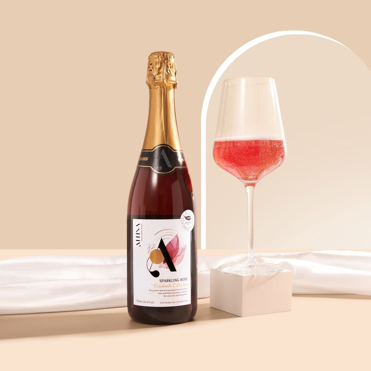 Altina Sparkling Rosé 750ml, bottle beside a poured glass, Scoop Wholefoods Cottesloe