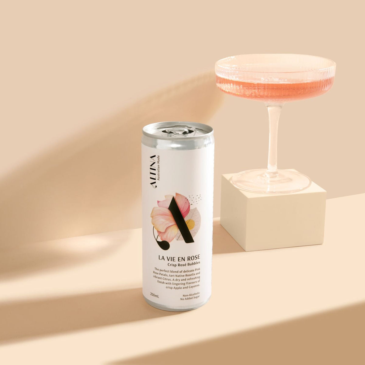 Altina La Vie En Rose 250ml, can beside a poured coupe, Scoop Wholefoods Cottesloe