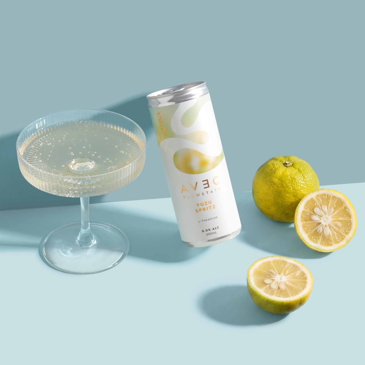 AVEC FlowState Yuzu Spritz 250ml, can with a poured coupe and cut yuzu, Scoop Wholefoods Cottesloe