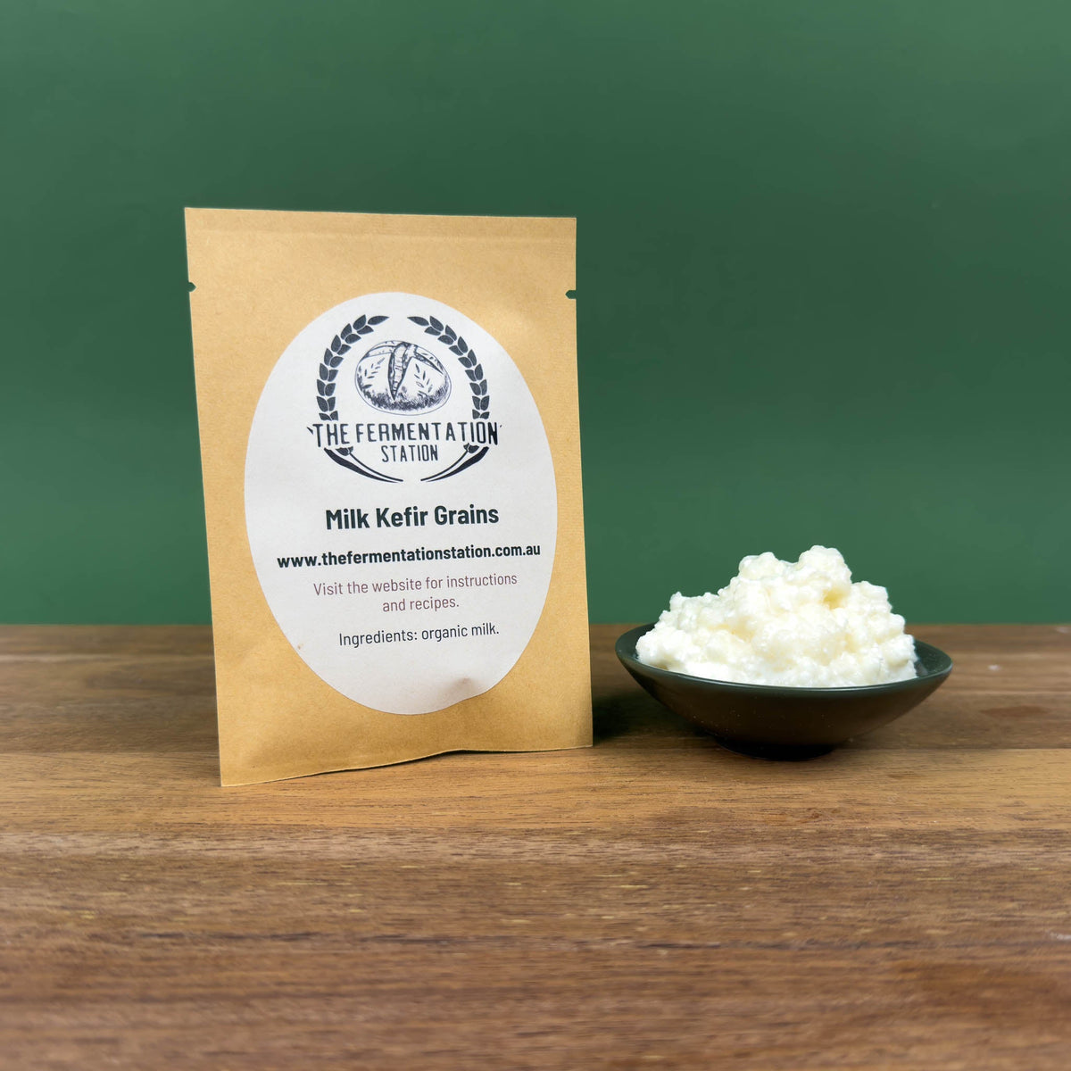 The Fermentation Station Milk Kefir Grains 16g, pack beside a bowl of live kefir grains, Scoop Wholefoods Cottesloe